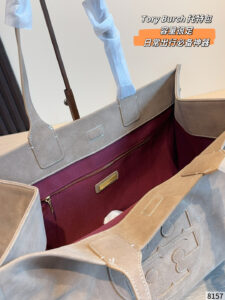 Tory Burch Ella tote bag in taupe suede with signature double T round logo on the front, top handle and carrying shoulders