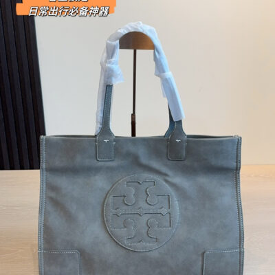 Tory Burch Ella tote bag in taupe suede with signature double T round logo on the front, top handle and carrying shoulders