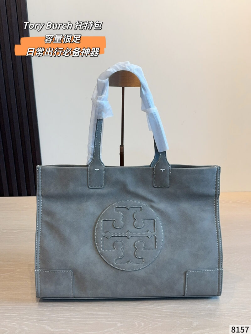 Tory Burch Ella tote bag in taupe suede with signature double T round logo on the front, top handle and carrying shoulders