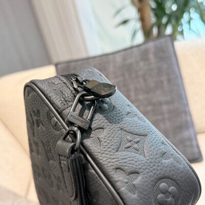 Louis Vuitton embossed cowhide clutch