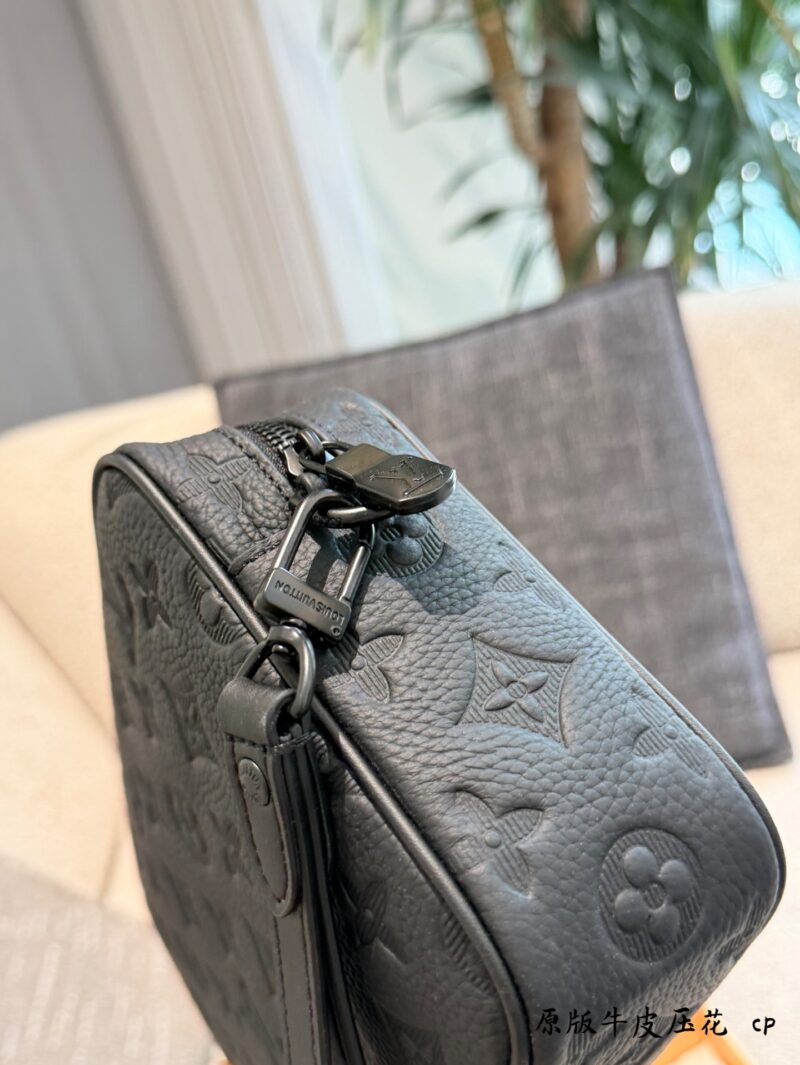 Louis Vuitton embossed cowhide clutch