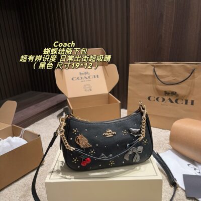 Coach This armpit bag in premium leather with metal chain and detachable shoulder strap is perfect for shoulder or handbag! Embroidered with fairy tales, embellished with elements such as butterflies, cherries, and bows, it is retro and childish. Just the size