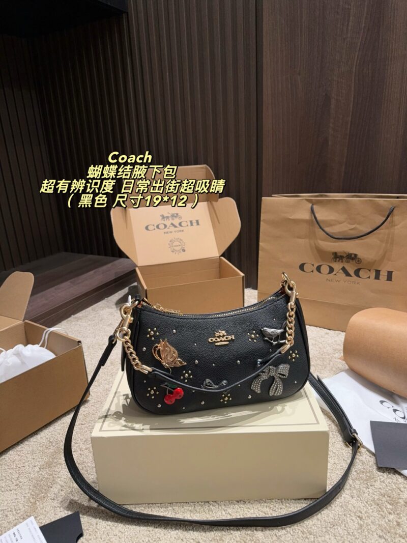 Coach This armpit bag in premium leather with metal chain and detachable shoulder strap is perfect for shoulder or handbag! Embroidered with fairy tales, embellished with elements such as butterflies, cherries, and bows, it is retro and childish. Just the size